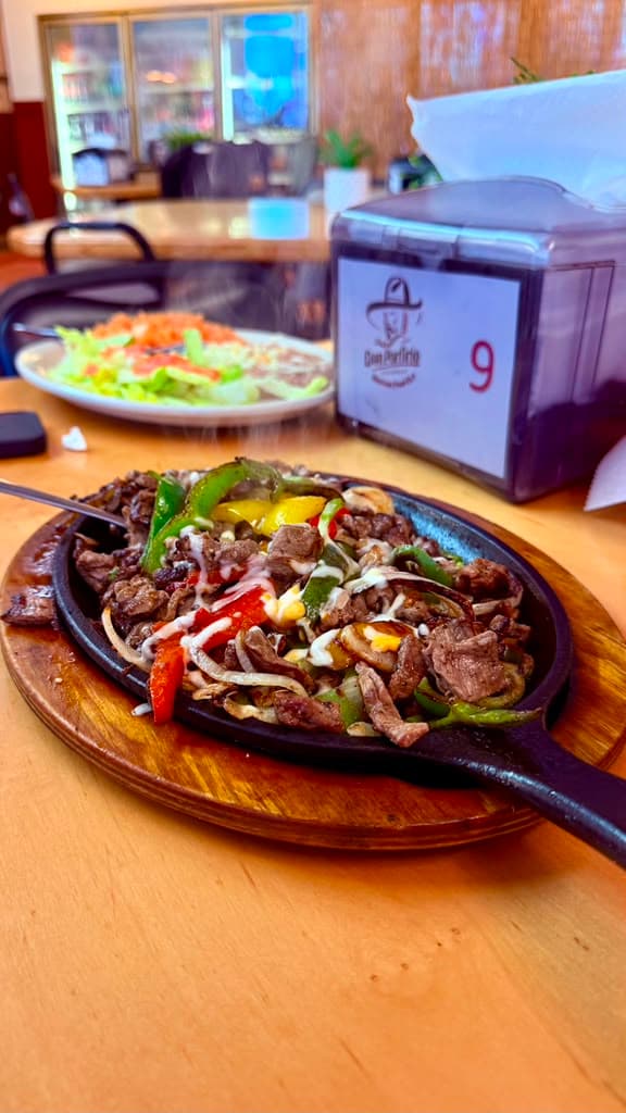Sizzling steak fajitas at Don Porfirio